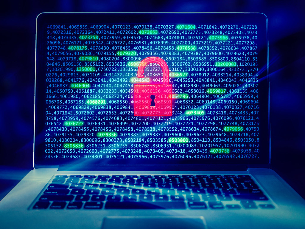 Digital security padlock on laptop screen representing data protection